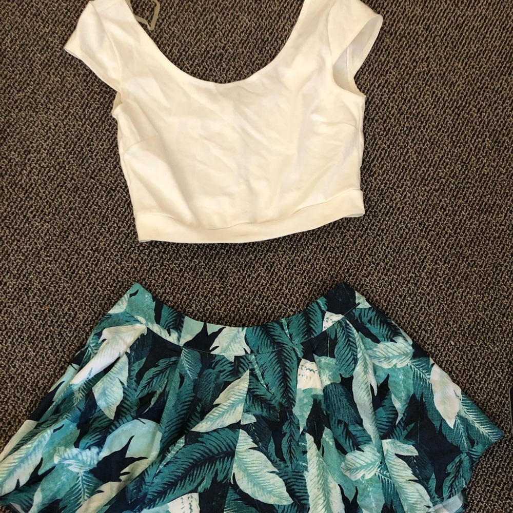 White crop top and green shorts that flare out